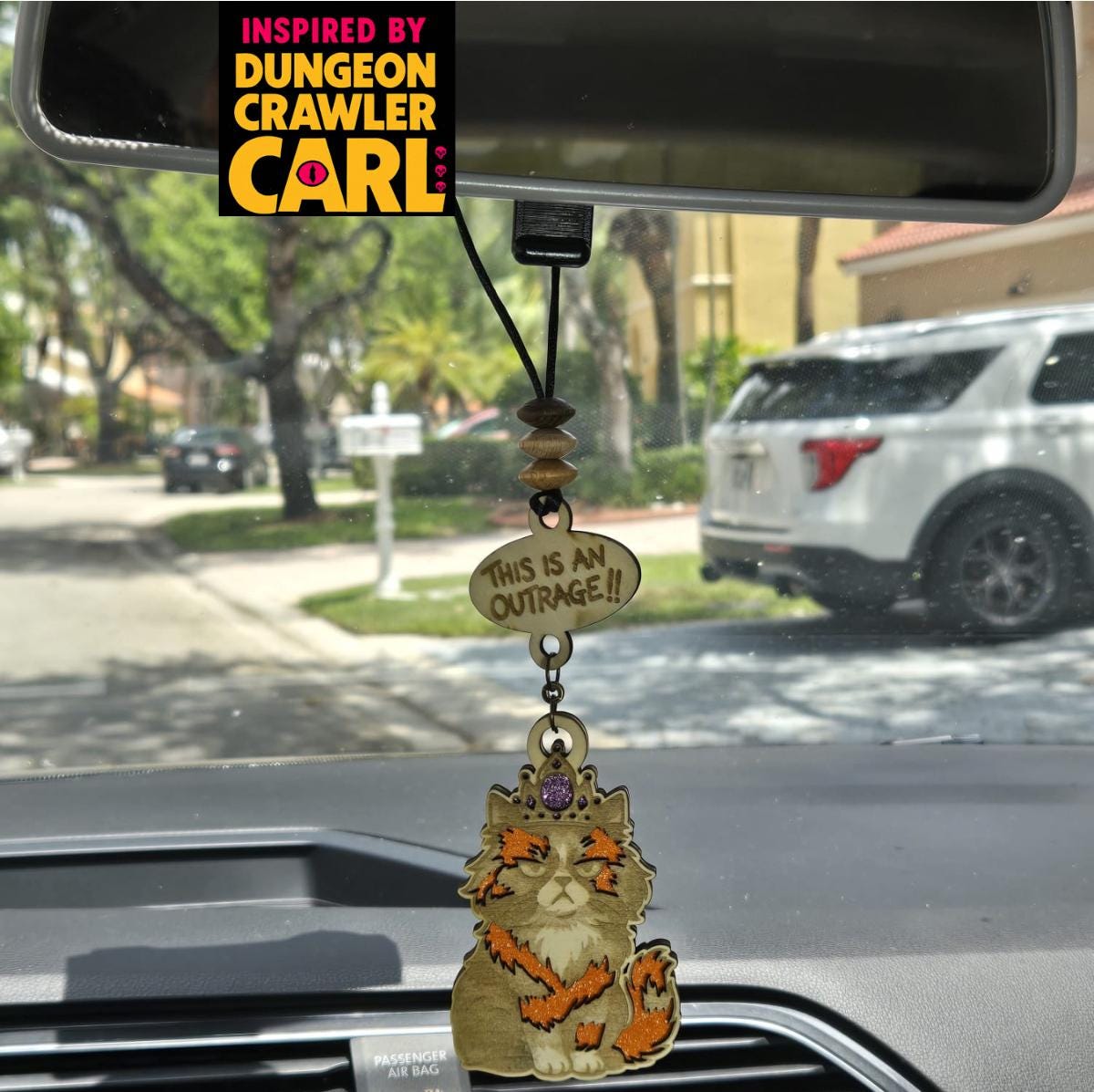 Dungeon crawler carl inspired car charm – princess donut "this is an outrage and quot;